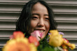 © Mattia/Stocksy - Portrait of an Asian Woman with Flowers