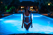 © David Prado/Stocksy - Woman on the swimming pool