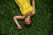 © Ani Dimi/Stocksy - Black Woman Laying Down In The Grass.
