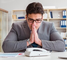 Businessman expecting important call on phone