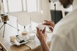 © Alba Vitta/Stocksy - Young man doing beauty routine video tutorial at home