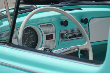 Wall Mural - Closeup of an antique car steering wheel.