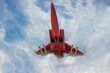 A Russian military aircraft of red color takes off through the obloka.