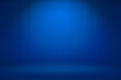 Empty dark blue studio room with light and shadow abstract background. Copy space studio room for present your products.