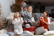 © ako-photography - young girls having fun wrapping gifts at home, great teamwork of friends packing presents for christmas