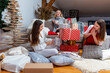 © ako-photography - young girls having fun wrapping gifts at home, great teamwork of friends packing presents for christmas