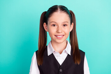 photo portrait little girl with tails smiling in uniform with two tails isolated pastel teal color b