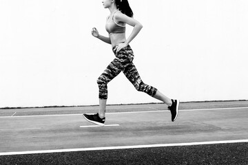 Wall Mural - White woman running on track