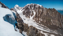 Panoramic View Of The Big Aktru Glacier, High In The Mountains, Covered By Snow And Ice. Altai Winter Landscape.