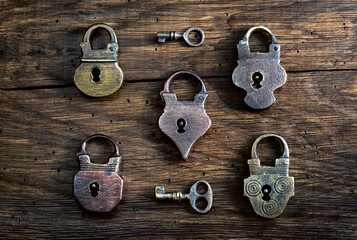 Fototapete - Collection of antique door locks and keys on an old board. Vintage padlock and key. set as a symbol of security, closeness, security, etc. Conceptual background.