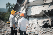 Demolition Control Supervisor And Contractor Discussing On Demolish Building.