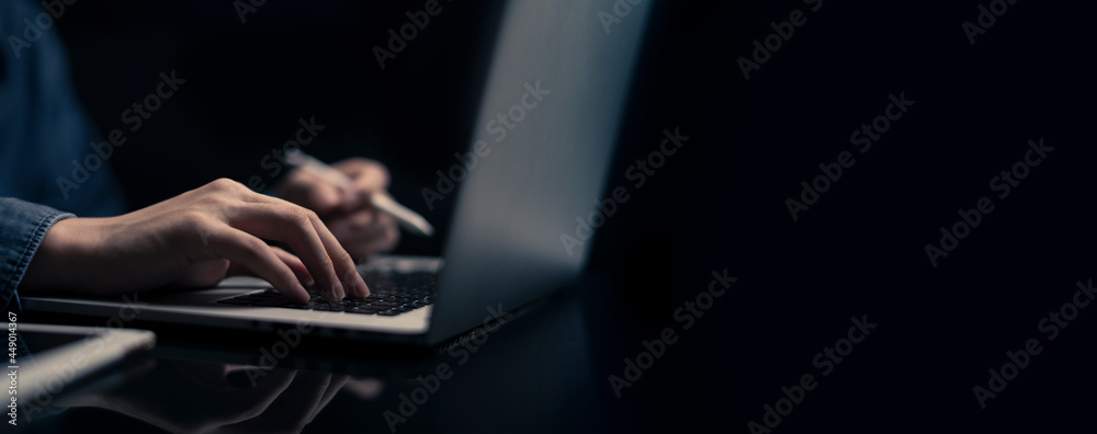 Businessman is working on Laptop. stock business or work from home concept. dark tone - obrazy, fototapety, plakaty 