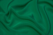 Texture, Background, Pattern. Texture Of Green Silk Fabric. Beautiful Emerald Green Soft Silk Fabric.