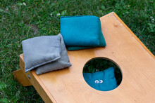 Corn Hole Or Bean Bag Toss Game Board And Bags With A Fun And Silly Face