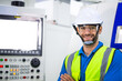 © winnievinzence - Portrait of confident male engineer foreman in safety helmet smile in arms crossed stand in front of factory production. man operating machine at industrial plant. men at work concept. copy space