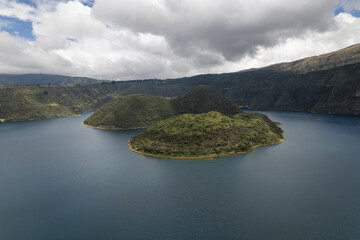 A drone shot of two islands inside the crater lake of Volcano Cuicocha in Ecuador