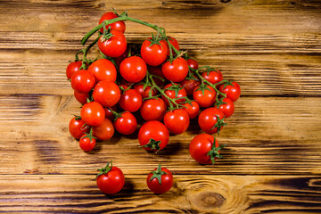 Wall Mural - Heap of small cherry tomatoes on wooden table