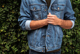 Fototapeta  - Męska kurtka jeansowa niebieska, zdjęcie reklamowe zbliżenie.