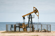 Oil pump jack at the caspian sea