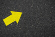 © sallies - Asphalt with a yellow arrow sign pointing to the upper right. Tarmac road with an arrow pointing to the upper right