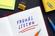 Business concept meaning FRUGAL LIVING with phrase on the page. Frugal living is the act of being very intentional with your spending.