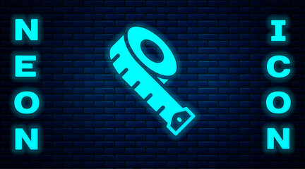 Wall Mural - Glowing neon Measuring tape icon isolated on brick wall background. Tape measure. Vector