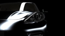 The Black Car Gradually Emerges From The Darkness Due To The Illumination And Disappears Again In The Darkness. Close-up On Headlights