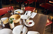 © Southworks - Used plates on table in restaurant after meal