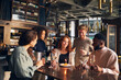 © Southworks - Friends celebrating birthday in wine bar
