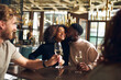 © Southworks - Man kissing woman in wine bar
