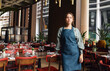 © Southworks - Portrait of confident female restaurant owner