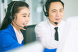 © bank215 - Asian call center team working together for support customer case in helpdesk concept