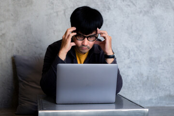 sad depression serious people from work,study stress problem.asian man feeling tired suffering using computer working work place.concept global economic,health problems