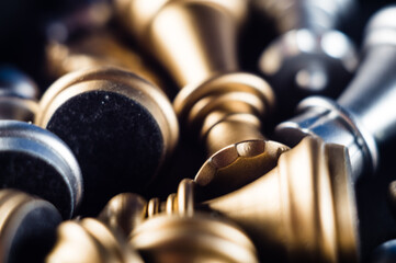 Canvas Print - Closeup shot of a pile of silver and gold chess pieces