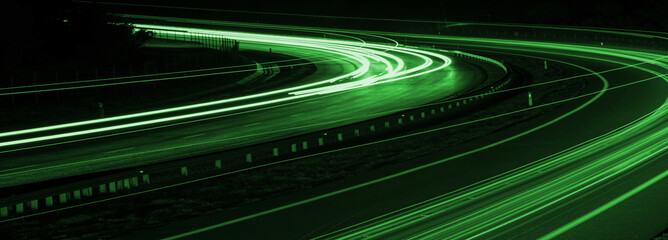 green car lights at night. long exposure