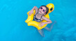 © Alona - Cute girl in sunglasses swimming with rubber duck in swimming pool