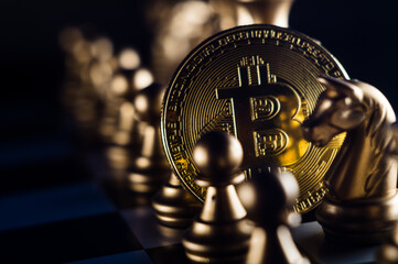 Poster - Closeup shot of crypto coin with chessmen on a chessboard- introducing investments strategies