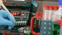 Sample Preparation For Mass Spectrometry In A Scientific Laboratory. Filling Test Tubes With Samples With A Pipette And Measuring Instruments On The Background