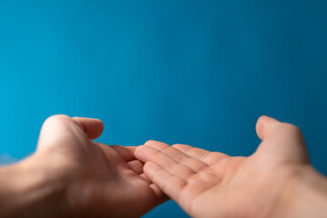 Wall Mural - male  shows outstretched hand with open palm