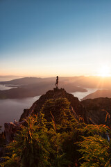 Wall Mural - Adventurous Caucasian Woman Hiking on top of a Rocky Mountain Cliff. Sunny Summer Sunset. Mnt Brunswick Hike, North of Vancouver, BC, Canada.