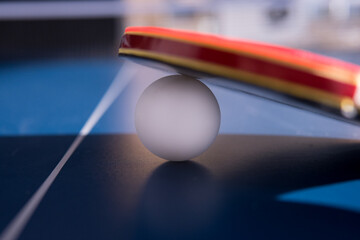 Pong racket and ball at the table office closeup