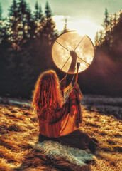 Poster - beautiful shamanic girl playing on shaman frame drum in the nature.