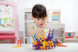 © M-image - young girl playing balance chairs  toy for homeschooling