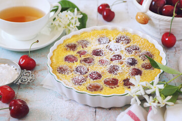 Wall Mural - Cherry clafoutis ang cup of Jasmine tea, french cuisine