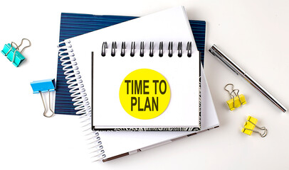 Poster - Sticker with TIME TO PLAN text on notebooks on the white background