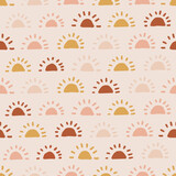 Fototapeta Zachód słońca - Boho sun seamless pattern. Summer baby print. Earthy warm trendy colors. Solar abstract modern nursery fabric design.