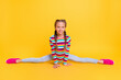 © deagreez - Photo of sporty little girl make twine wear striped shirt jeans sneakers isolated yellow color background