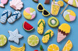 Happy summer solstice beach vacation tropical theme cookies on sky blue background