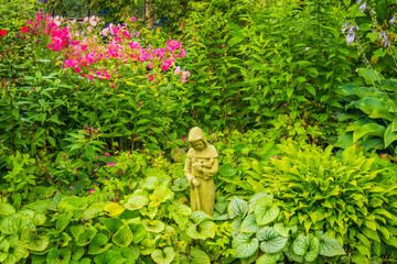 Wall Mural - peaceful garden with statue of St Francis of Assisi
