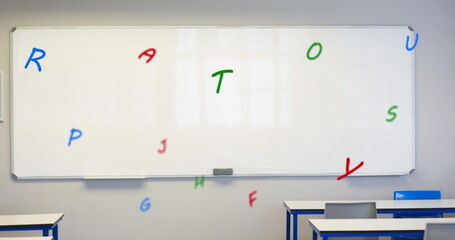 Poster - digital composition of multiple colorful alphabets floating against white board in empty classroom